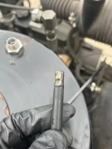 Warped and damaged photocell flame sensor from Nilfisk Contractor diesel hot pressure washer burner.